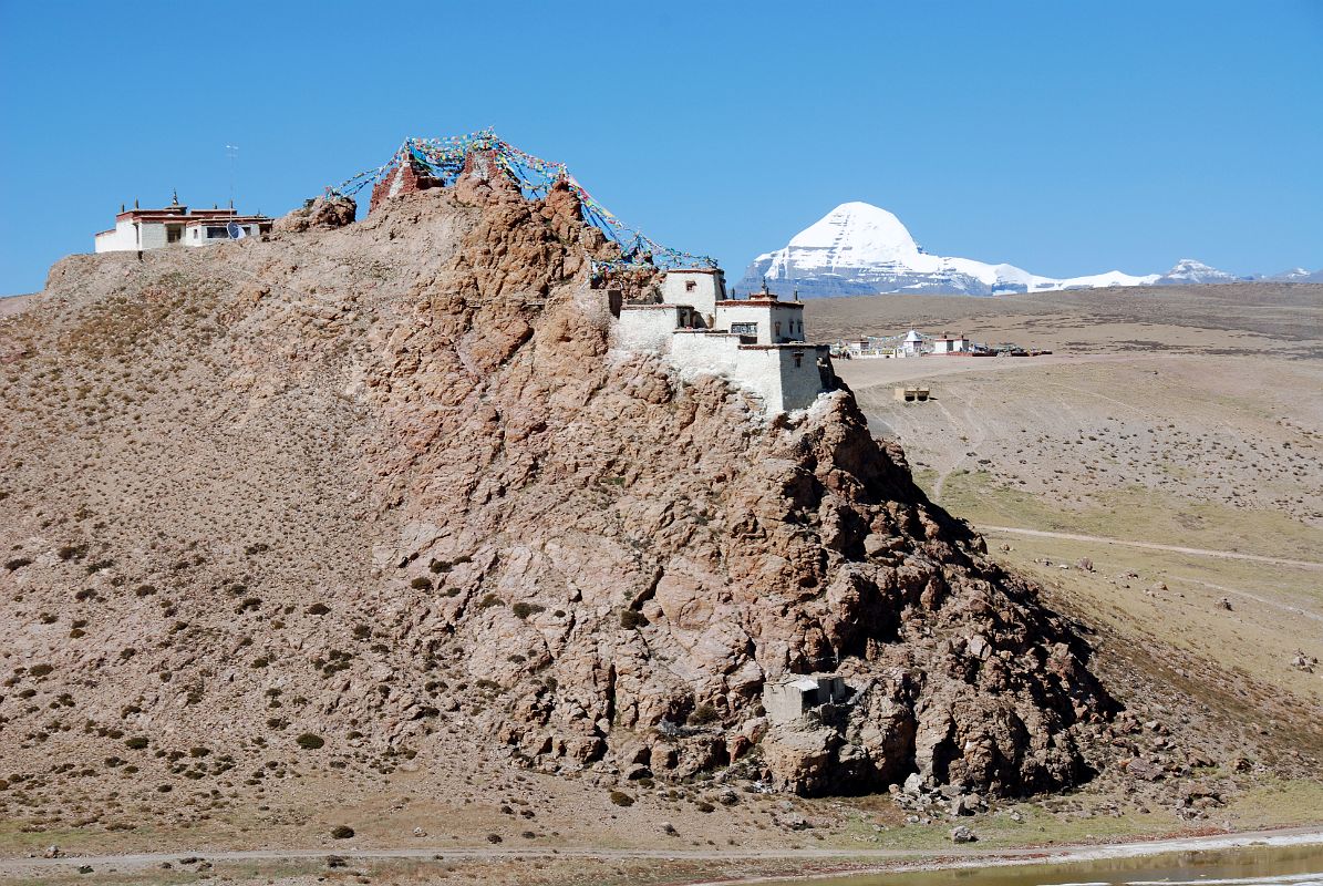 33 New And Old Chiu Gompas Perched On A Hill With Mount Kailash Behind New Chiu Gompa (left) and the old Chiu Gompa (right) are perched on a hill with a perfect view of Mount Kailash beyond.